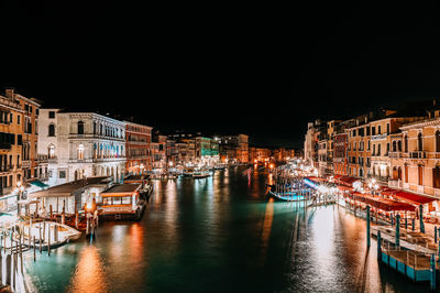 Illuminated buildings in city at night