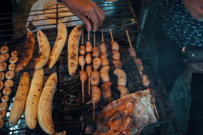 High angle view of meat on barbecue grill