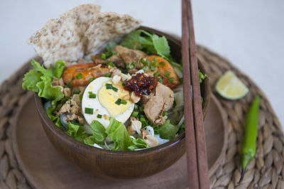 Vietnamese noodle - my quang, vietnamese traditional cuisine, noodles in bowl on the table 