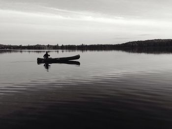 Boats in calm lake