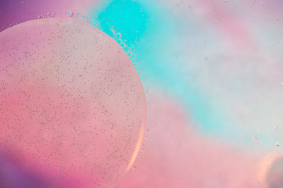 Close-up of bubbles against blue background