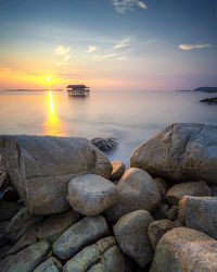 Scenic view of sea against sky during sunset