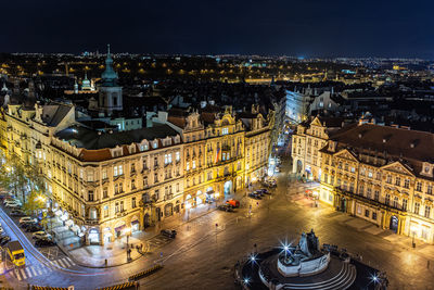 High angle view of city lit up at night