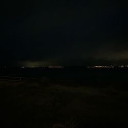 Scenic view of sea against sky at night