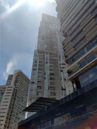 Low angle view of modern buildings against sky