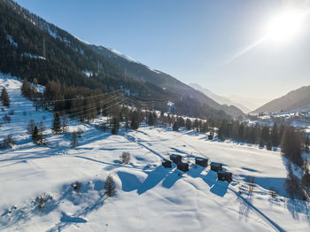 Scenic view of snow covered mountains against sky