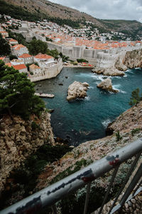 High angle view of town by sea