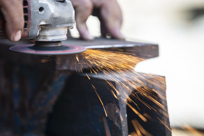 Close-up of person working in factory