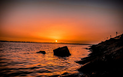 Scenic view of sea against sky during sunset