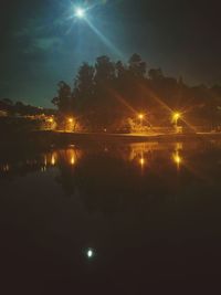 Scenic view of lake against sky at sunrise