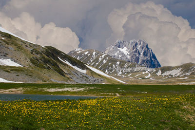 Scenic view of snowcapped mountains against sky