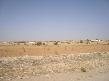 Scenic view of desert against clear sky