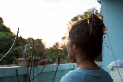 Rear view of woman with hair bun 