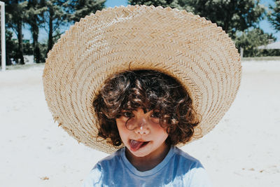 Boy wearing hat at beach