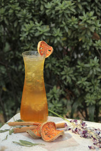 Close-up of orange on glass table