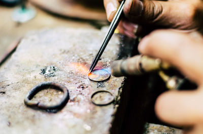 Close-up of person making ring