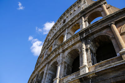 Low angle view of coliseum against sky