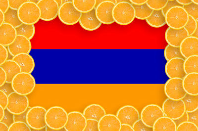 Digital composite image of orange fruit against blue background