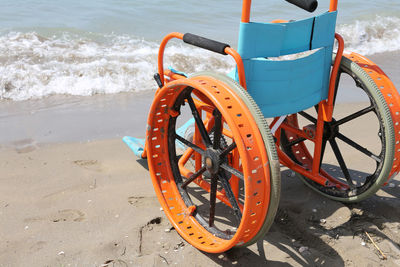 High angle view of bicycle wheel on beach
