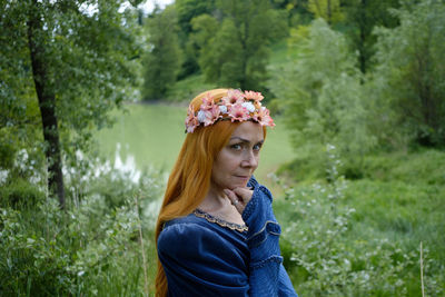 Portrait of young woman looking at camera