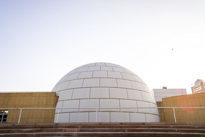 Low angle view of modern buildings against clear sky