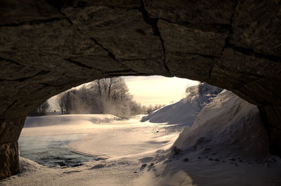 Scenic view of snow covered landscape against sky