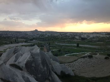 Scenic view of landscape against cloudy sky