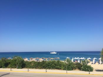 Scenic view of sea against clear blue sky