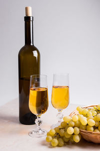 Glass of bottles on table