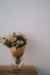 Close-up of vase against white background