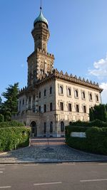 Low angle view of historical building against blue sky