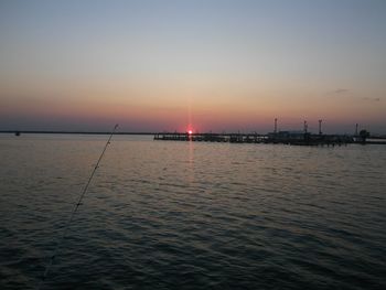 Scenic view of sea against clear sky during sunset