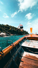 Man on boat against sky