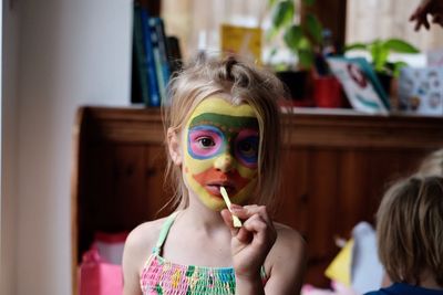 Girl wearing mask at home