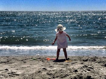 Woman standing on beach