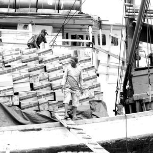 Group of people working on boat