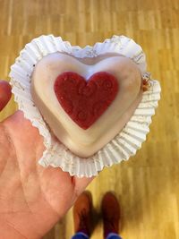 Close-up of hand holding heart shape