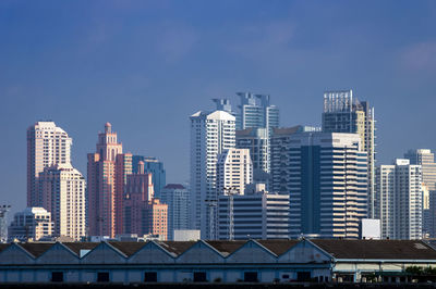 Modern buildings in city against sky