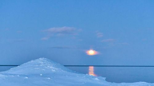 Scenic view of sea against sky during winter