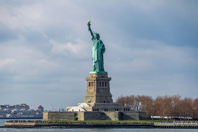 Low angle view of statue against sky