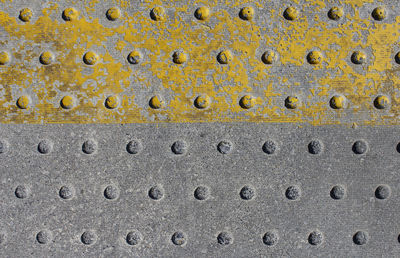 Close-up of holes in concrete wall