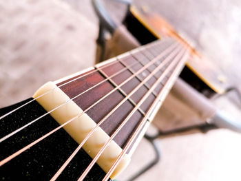 Close-up of guitar on table