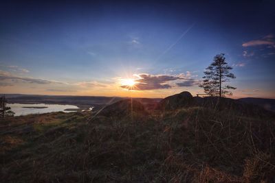 Scenic view of landscape at sunset