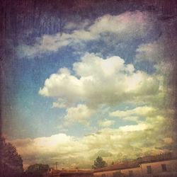 Low angle view of built structure against cloudy sky