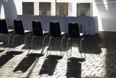Empty chairs at voting booth