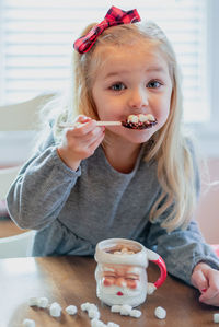 Portrait of a girl eating ice cream