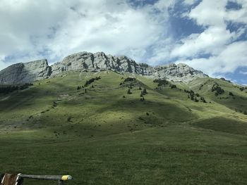 Scenic view of landscape and mountains against sky