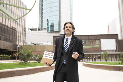 Full length of a man standing in city