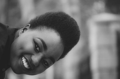 Close-up portrait of smiling young woman