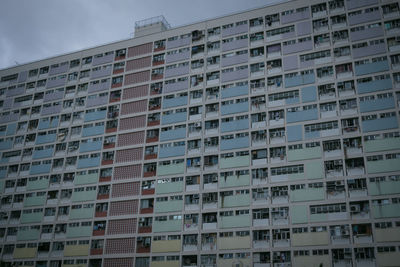 Low angle view of apartment building against sky